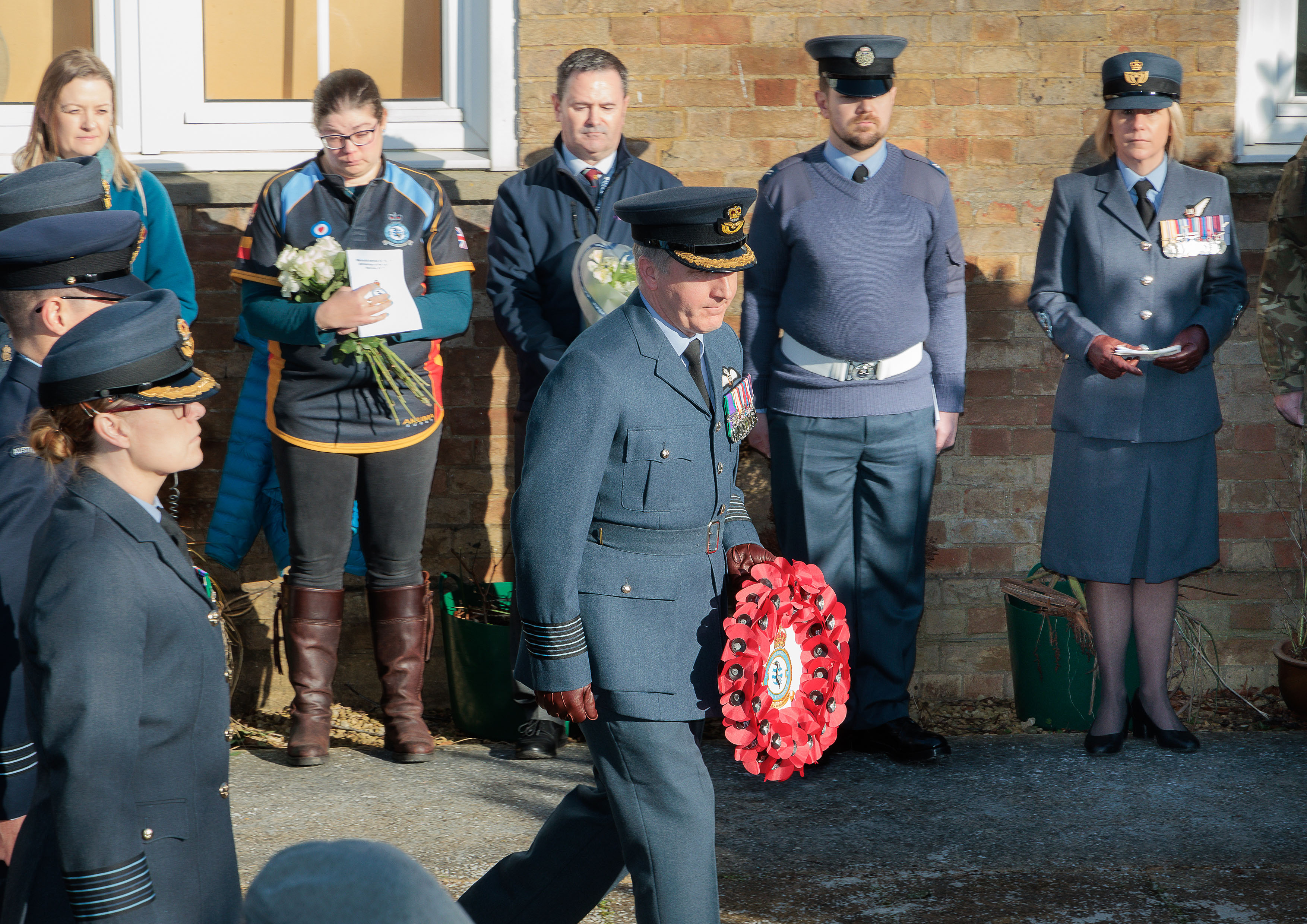 Photo depicting a gathering for the memorial service, at RAF Brize Norton, to mark 20 years since the crash of RAF C-130K Hercules XV179.